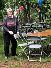 Sister Lynn Marie helps to set up for the picnic